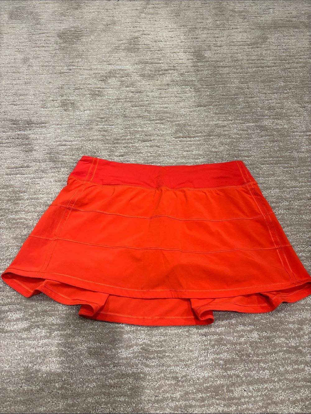Lululemon orange red pace rival skirt. Size 8 regular.